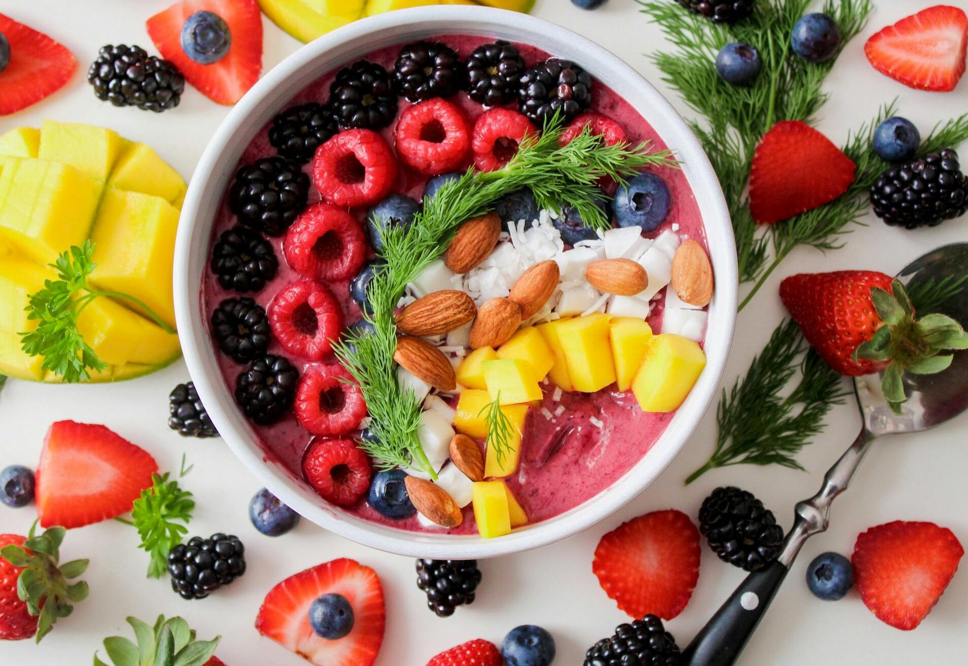 A vibrant smoothie bowl with fresh fruits and nuts - a perfect start for a healthy lifestyle.