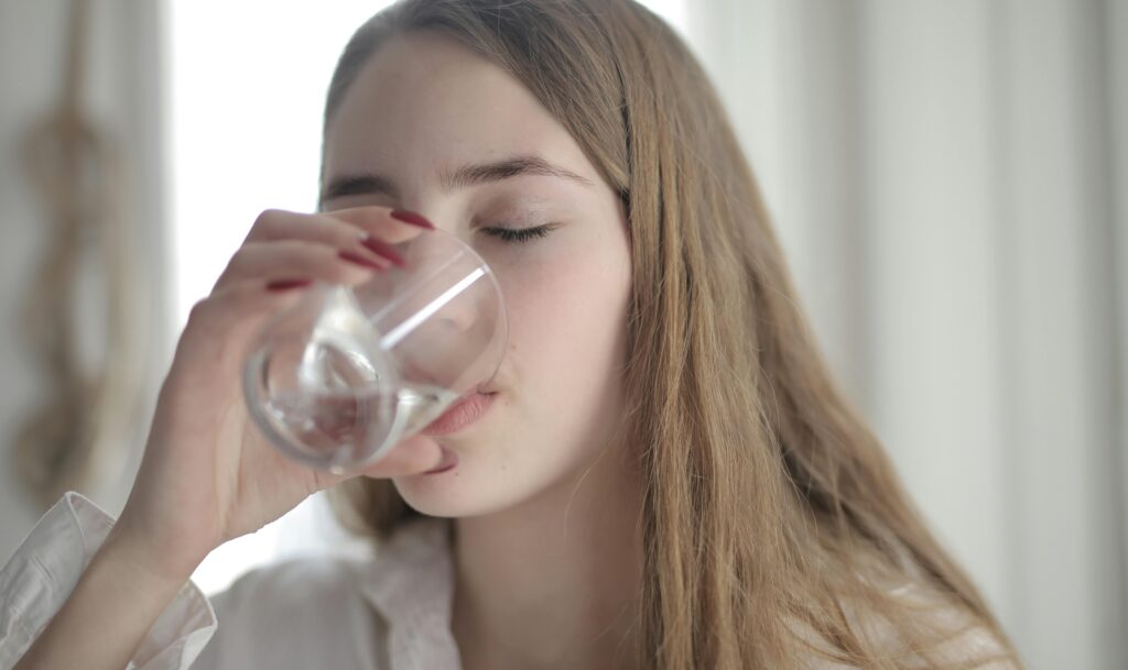 Woman drinking water for a healthy lifestyle